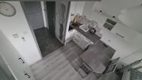 Kuchyňa alebo kuchynka v ubytovaní Gyulai-fürdő-apartman II.