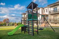 a playground in front of a house with a slide at Paroraia in Angistron