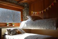 A bed or beds in a room at LA MURA’ - Il vostro posto nel Gran Paradiso