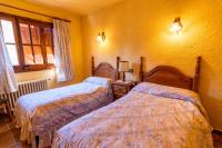 Postel nebo postele na pokoji v ubytování EVA & TRAVEL - El Bosquet de Prades