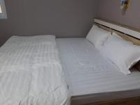 Postel nebo postele na pokoji v ubytování Green House Resort Praduyuen