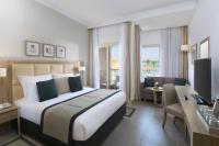 Postel nebo postele na pokoji v ubytování JAZ Elite Casa Del Mar Beach