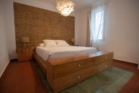 Postel nebo postele na pokoji v ubytování VILLA DEL RIU