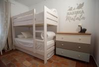 Postel nebo postele na pokoji v ubytování VILLA DEL RIU