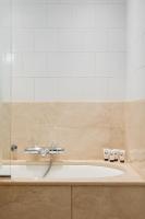 a bathroom with a sink and a shower at Hôtel de l&#39;Abbaye in Paris