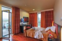 A bed or beds in a room at Victoria Terme Hotel