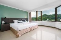 I Pavilion Hotel Phuketにあるベッド