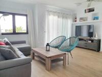 Televízia a/alebo spoločenská miestnosť v ubytovaní COSTA LUZ Relax Suite