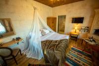 Postel nebo postele na pokoji v ubytování Duven Hotel Cappadocia