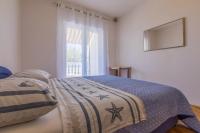 Posteľ alebo postele v izbe v ubytovaní Apartment in Jadranovo 14267