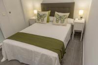 Postel nebo postele na pokoji v ubytování Apartamentos Constitución by Renthas