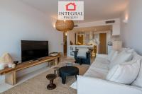 A television and/or entertainment centre at Palamós Moonlight Apartment