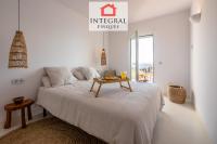 A bed or beds in a room at Palamós Moonlight Apartment