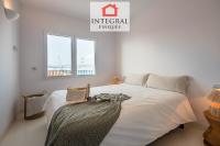 A bed or beds in a room at Palamós Moonlight Apartment