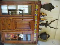 a wooden cabinet with a fish on the wall at Alongs Garden in Hengchun South Gate