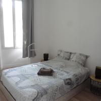 a bedroom with a bed with a blanket on it at Villa Zola in Aix-en-Provence