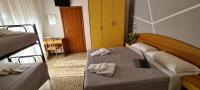 Łóżko lub łóżka w pokoju w obiekcie Hotel Astoria