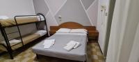 Łóżko lub łóżka w pokoju w obiekcie Hotel Astoria