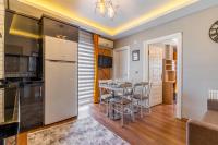 A kitchen or kitchenette at Umut Apartments