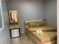 Postel nebo postele na pokoji v ubytování Green House Resort Praduyuen