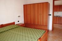 A bed or beds in a room at Case Vacanze Pietragrande