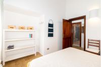 A bed or beds in a room at Villa vista Mare Santa Teresa