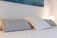 A bed or beds in a room at Villa vista Mare Santa Teresa