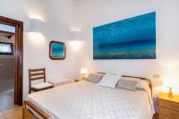 A bed or beds in a room at Villa vista Mare Santa Teresa