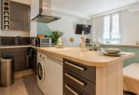 a kitchen with a counter top with a dishwasher at Studio climatisé à 50m des plages in Nice