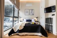 A bed or beds in a room at BILBAO URBAN by STAYNN APARTMENTS