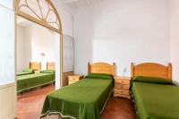 A bed or beds in a room at Camps 4 bedroom house, Ciutadella