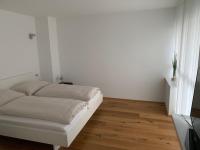 Posteľ alebo postele v izbe v ubytovaní Zimmer & Appartements am Schloßplatz