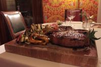 a plate of meat and vegetables on a table at Hotel Albani Firenze in Florence