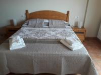 Postel nebo postele na pokoji v ubytování Apartamentos Mirador de Gúdar