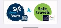two stickers with the words safe train in canada and safe travels at Casa di nonno Giovanni in Buzet