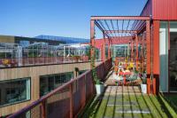 a balcony with a table and chairs on a building at Zoku Copenhagen in Copenhagen