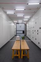 a locker room with a wooden table and a bench at Zoku Copenhagen in Copenhagen