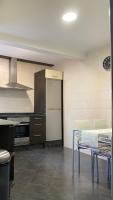 A kitchen or kitchenette at PiyMargall2 By Vigovacaciones