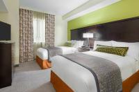 Staybridge Suites - Miami International Airport by IHGにあるベッド