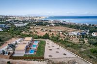 an aerial view of a house with the ocean at Anar Villas Rhodes in Koskinou