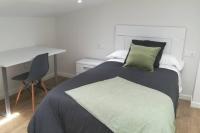 A bed or beds in a room at Casa Corredoira