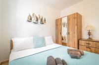 A bed or beds in a room at DS Traditional Villas Santorini Island