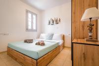 A bed or beds in a room at DS Traditional Villas Santorini Island