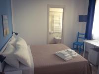 Posteľ alebo postele v izbe v ubytovaní B&B La Rosa dei Venti