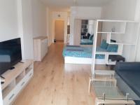 A television and/or entertainment centre at Huge Apartment with a parking space in the same building