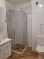 A bathroom at Huge Apartment with a parking space in the same building