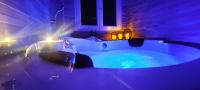 a bathroom with a tub with lights in it at A l&#39;Orée des pins - Gite indépendant avec baignoire balnéo et Home Cinéma en sup - Voir info de l&#39;hôte in Cuges-les-Pins