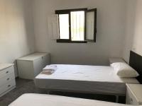 Łóżko lub łóżka w pokoju w obiekcie CASA RURAL CABO de GATA-NÍJAR