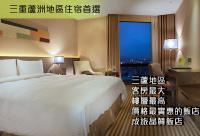 a hotel room with a large bed and a window at Park City Hotel - Luzhou Taipei in Taipei