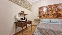 Posteľ alebo postele v izbe v ubytovaní Residenza dei Longobardi Affittacamere